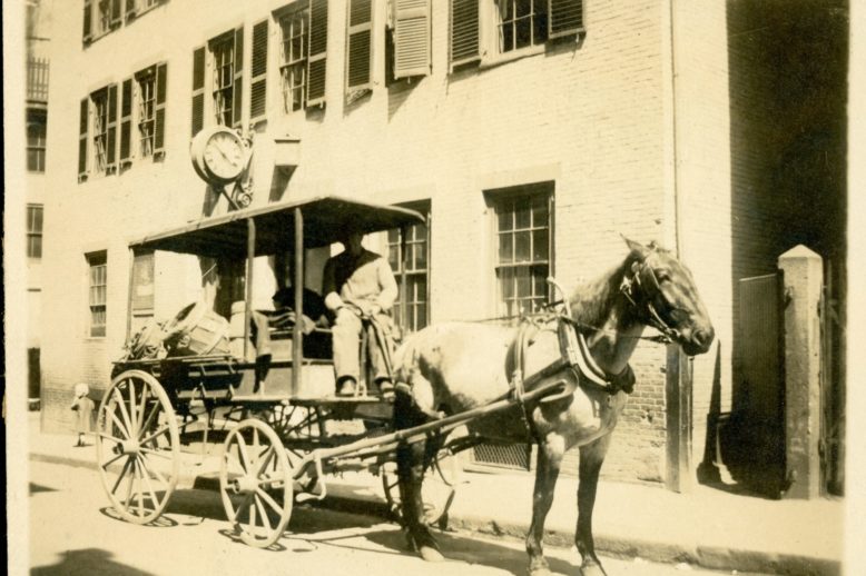 Horse-drawn wagon in front of the first Elizabeth Peabody House on Poplar Street (c. 1900). The EPH on Poplar