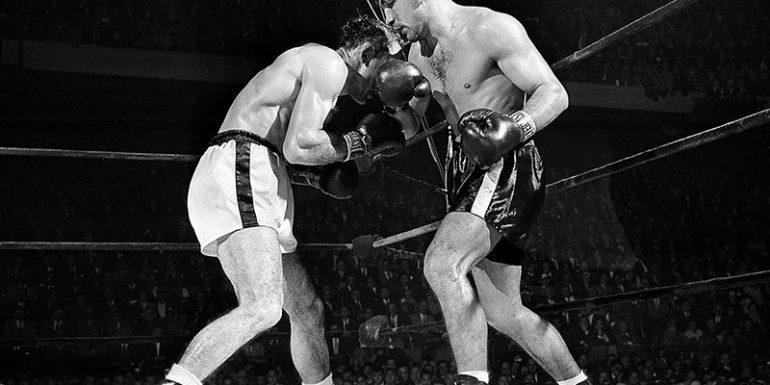 Tony Demarco landing a right hand punch on Carmen Basilio