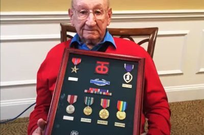 Manny Brown holding his medals