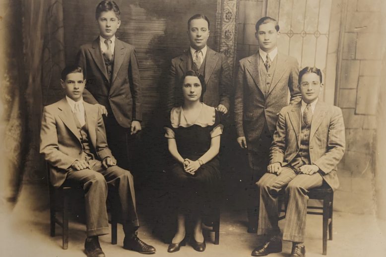 The West End House Debating Team of 1930-31 (The West End Museum Collection). Six persons sitting in 2 rows with a woman in the front center