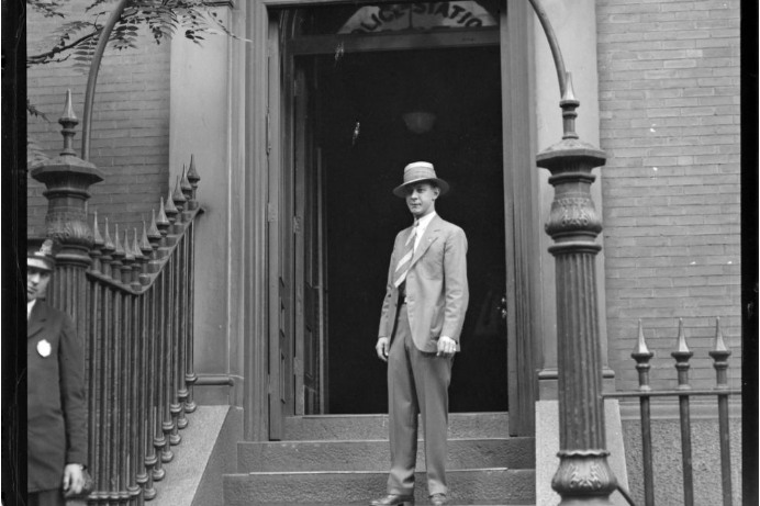 A man standing in front of the Joy Street Police Station