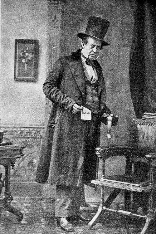 A man in a top hat and long coat