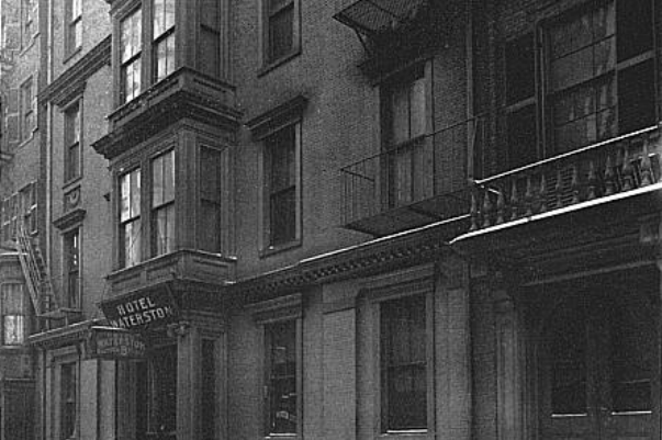 A closeup of facades of 2 buildings in the federalist style