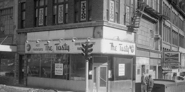 The Tasty in Scollay Square A store on the corner with a large script sign reading The Tasty, Hot Frankfurts, Coffee