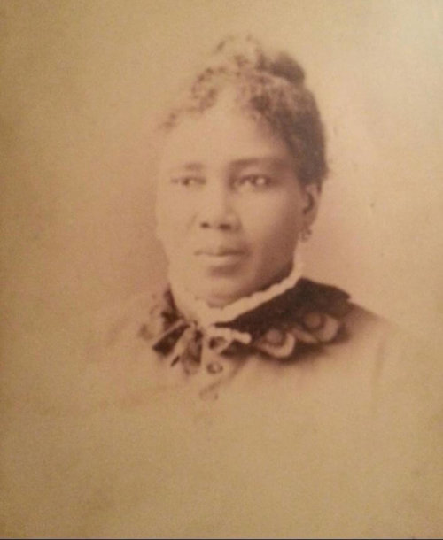 A portrait of a Black woman in fine clothes