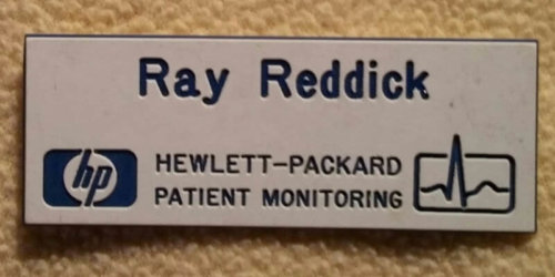 An employee badge reading Ray Reddick Hewlett-Packard Patient Monitoring