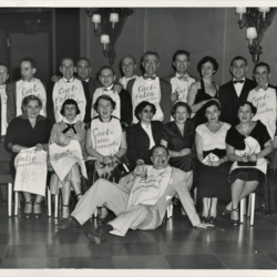 A group of men and women wearing bibs reading Carl Entin Association, WEH '45