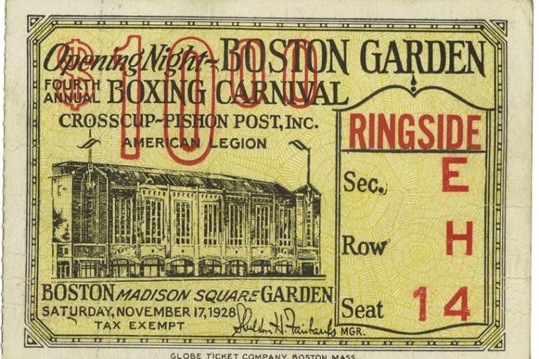 An ornate yellow ticket listing a $10 price, Sect5ion E, Row H, Seat 14, and a picture of the old Boston Garden