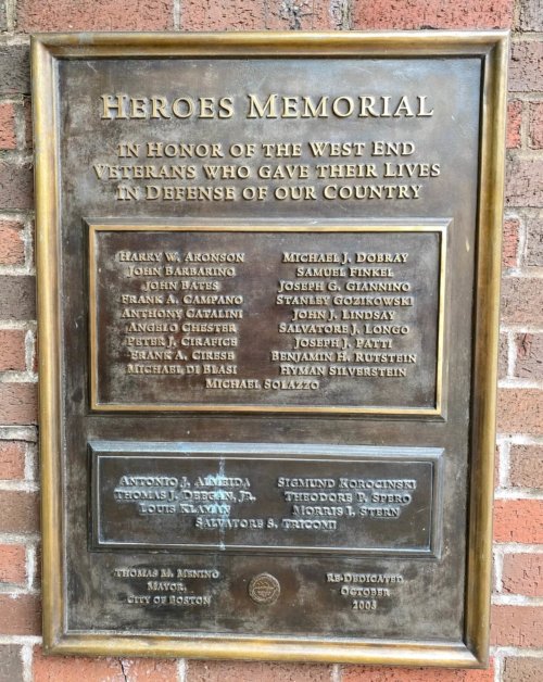Photograph of a plaque titled Heroes Memorial with a two rows of names listed below.