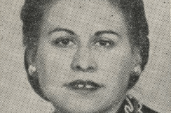Gladys Shapiro Photograph of a woman with pulled back hair, wearing a dress with an embroidered collar.