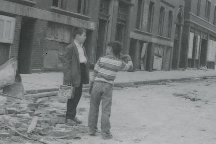Treasures from the West End Museum Archives event photo Two boys standing in a street by a demolished building