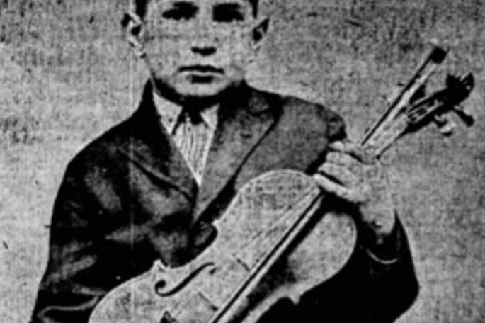 Boy with piano in 1924.