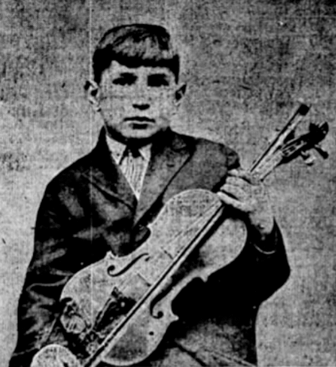 Boy with piano in 1924.