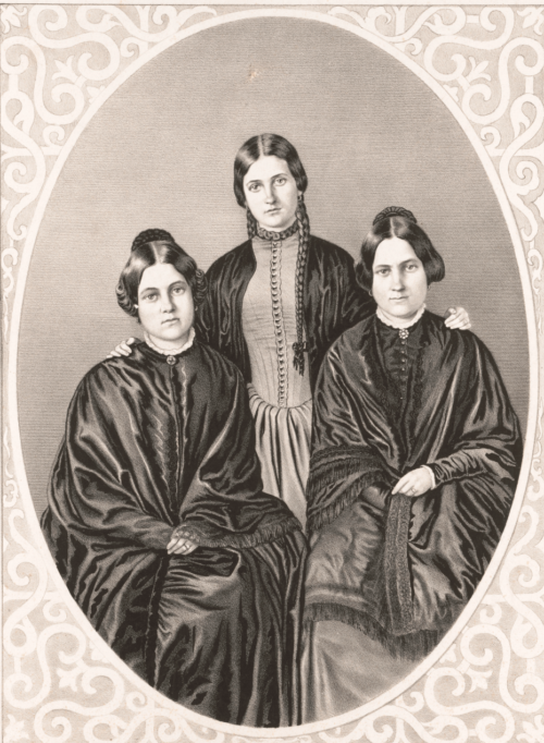 Three Fox Sisters sit for a portrait.