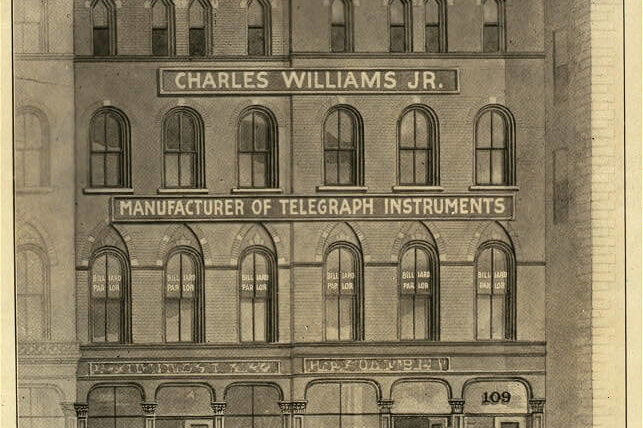 An 1879 print of a five-story building, with signs on it that say "Charles William Jr"