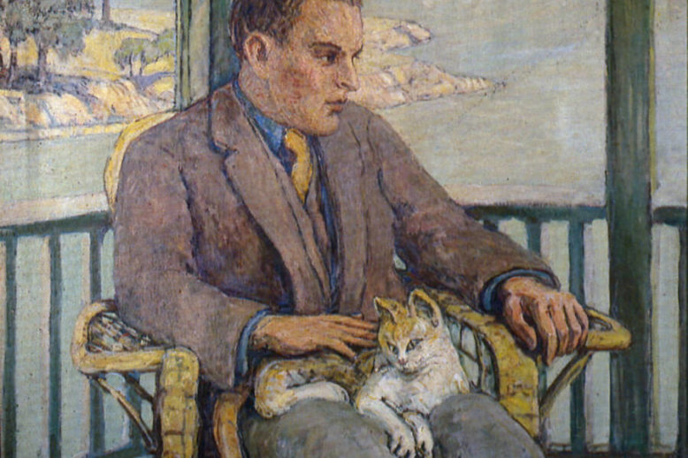 A painting of a young man, seated and visible from the knees upward, in profile, wearing a brown jacket, blue shirt, and yellow tie. He has one hand on the orange and white cat in his lap. There is a coastal scene with trees and distant buildings visible through the open window behind him.