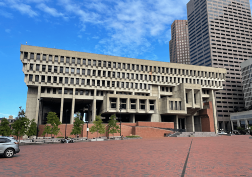 Boston's City Hall photographed: a large concrete building adorned with windows.