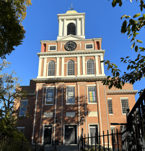 A four story brick church. It is federal in style with columns and pilasters.