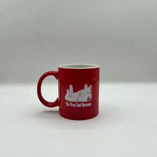 Red mug with a picture of a bridge and the words The West End Museum