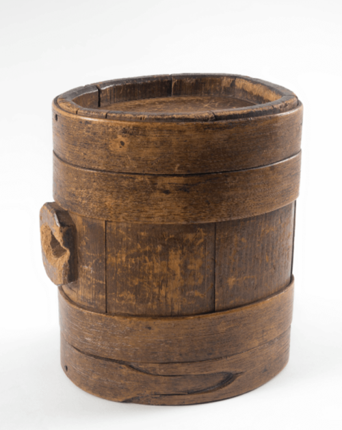 A photograph of a small wood keg.