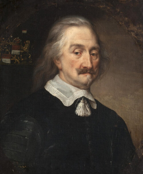 A portrait of a man with long grey hair a mustache and a white starched collar.