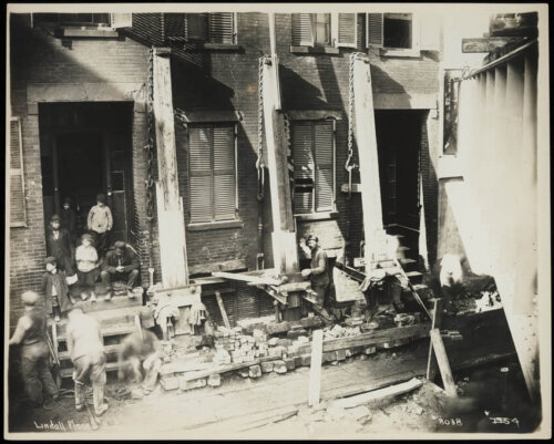 Kids watch construction from their front poarch.