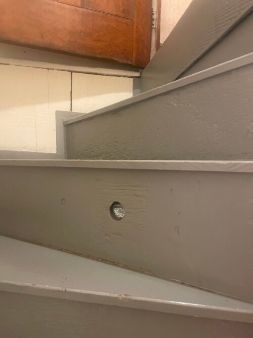 An image of curving stairs with a small hole in the middle.