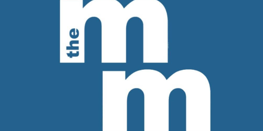 A blue background with two large lowercase "m"s