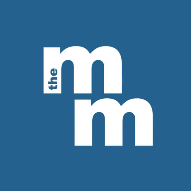 A blue background with two large lowercase "m"s