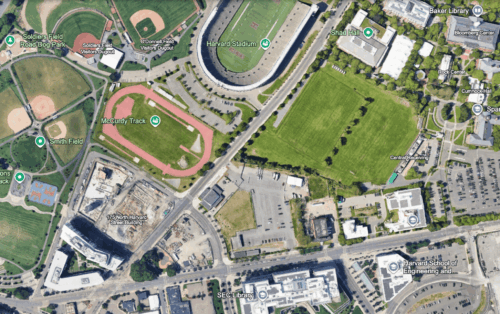 A satellite image of a neighborhood with two sports stadiums and several housing developments.