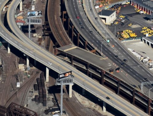 An elevated highway showing two continuous roads and a ramp that remains unfinished.