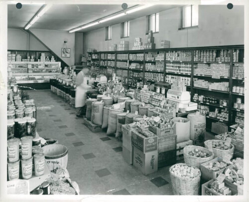 An interior of an old fashioned grocery store with mostly dry goods.