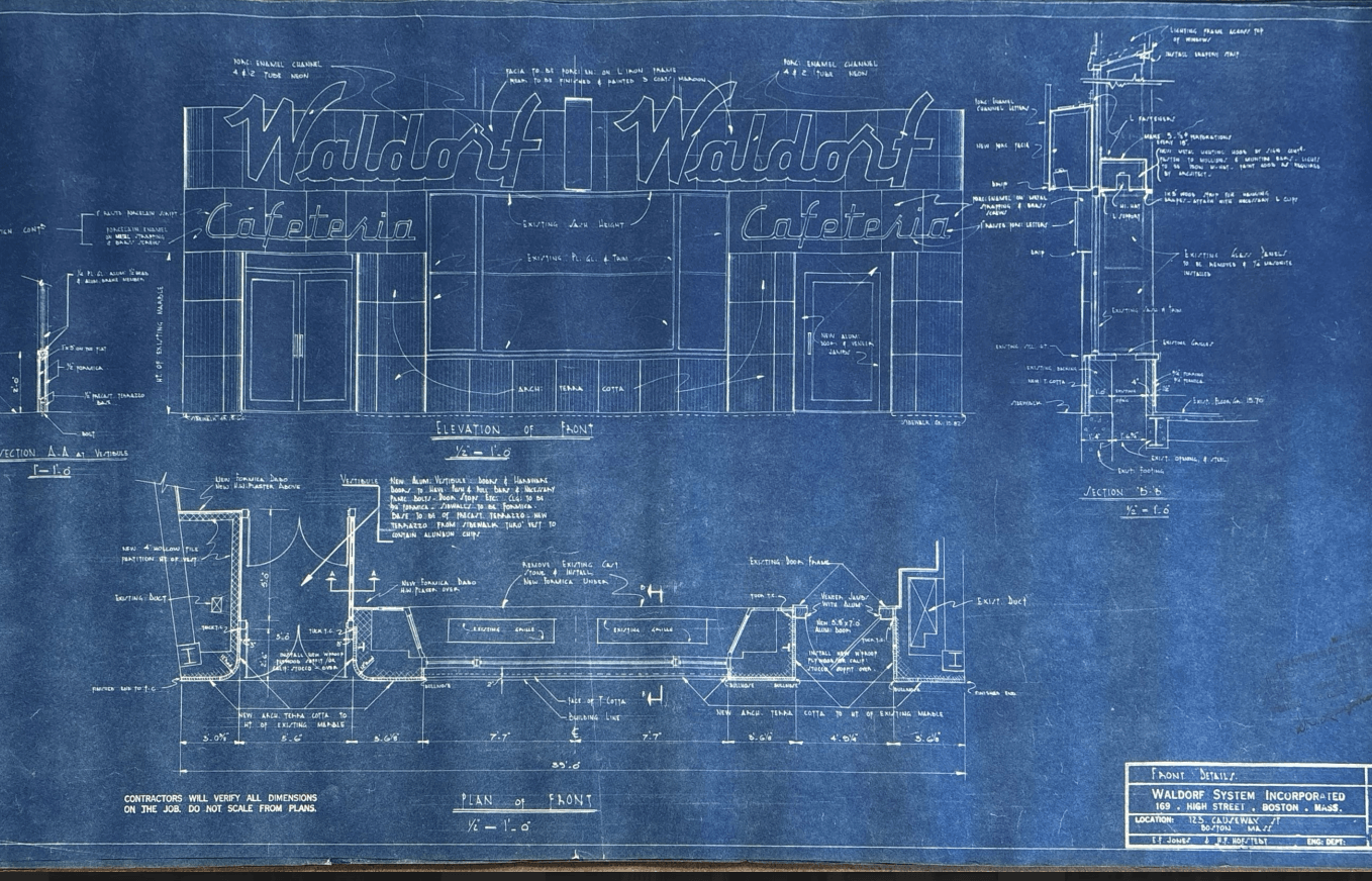 A blueprint showing the faced and interior of a building with Waldorf Cafeteria on the outside.