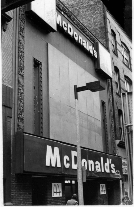 The front of a McDonald's restaurant in black and white.