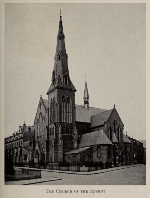 A church building with a tall spire and a chapel coming off the side.