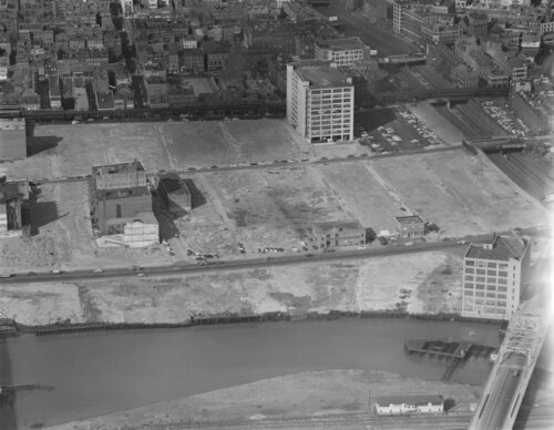 An aerial photo of an area of a city where most of the buildings have been destroyed.