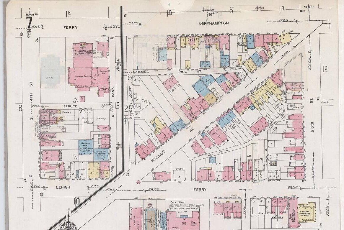 A detail of a fire insurance map with a blue building in the upper left corner whited out.
