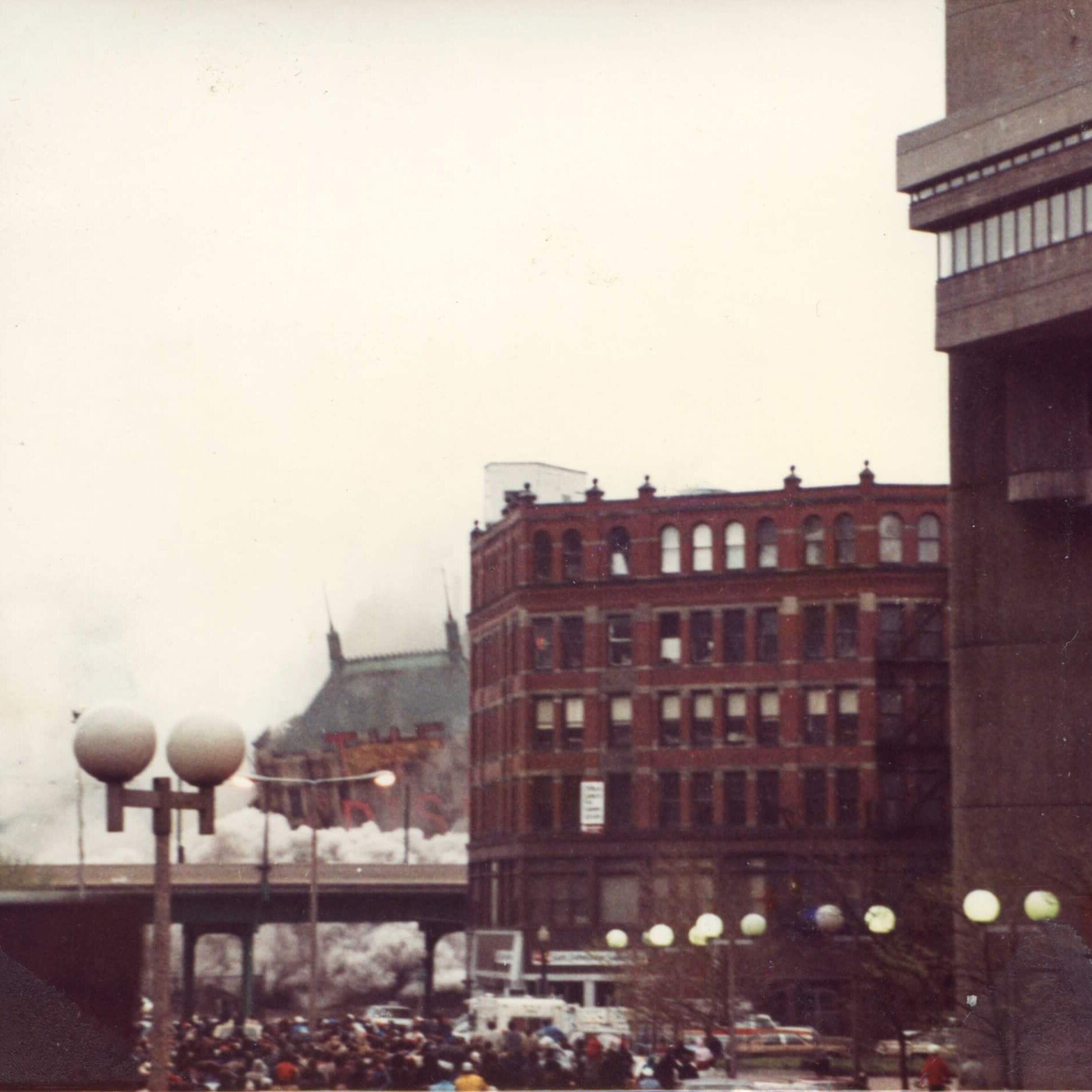 A tall hotel with the marquee that says Madison. The roof is all that can be seen.