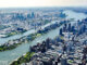 An aerial view of New York City including Roosevelt Island in between Queens and Manhattan.