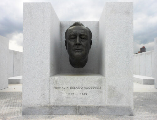 A bronze head of Franklin D. Roosevelt seemingly floating between three slabs of stone.