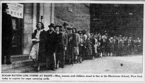 A newspaper clipping showing a long line of men and women in 1940s clothes lining up next to a brick building.