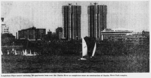 Newspaper clipping showing two tall towers overlooking a river. The river has several sail boats in the water.