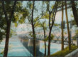 A colored photo of a railway bridge over a river with trees lining the river bank.