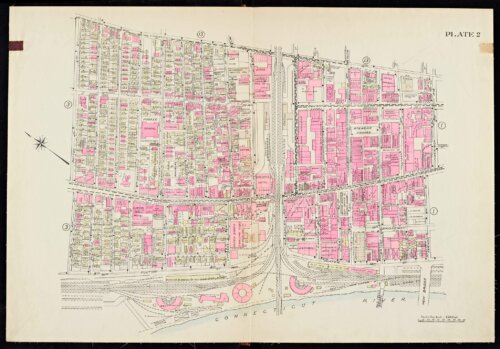 An atlas page showing a river on the bottom edge with an inverted T in the middle of a neighborhood.