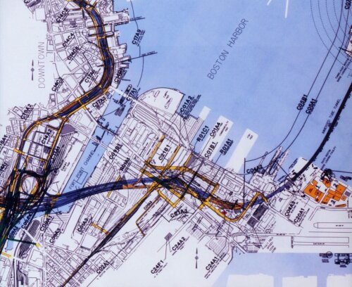 A map showing an area of a city with the highways highlighted in blue and yellow. They are running underneath two sections of the city through tunnels under ground and water.