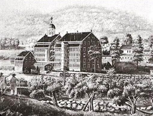 An engraving showing a mill building next to a canal and an orchard. The mill has a bell cupola and is connected to a water wheel.