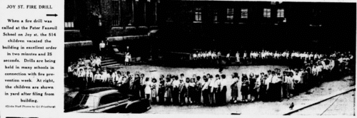 A newspaper photo of children lining up outside of a school for a fire drill.