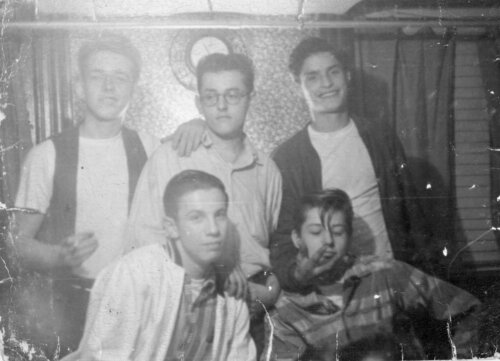 Two rows of 5 boys. The back row is standing and the bottom row is sitting.