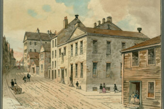 A watercolor showing a street with a central brick building with several children running towards it.